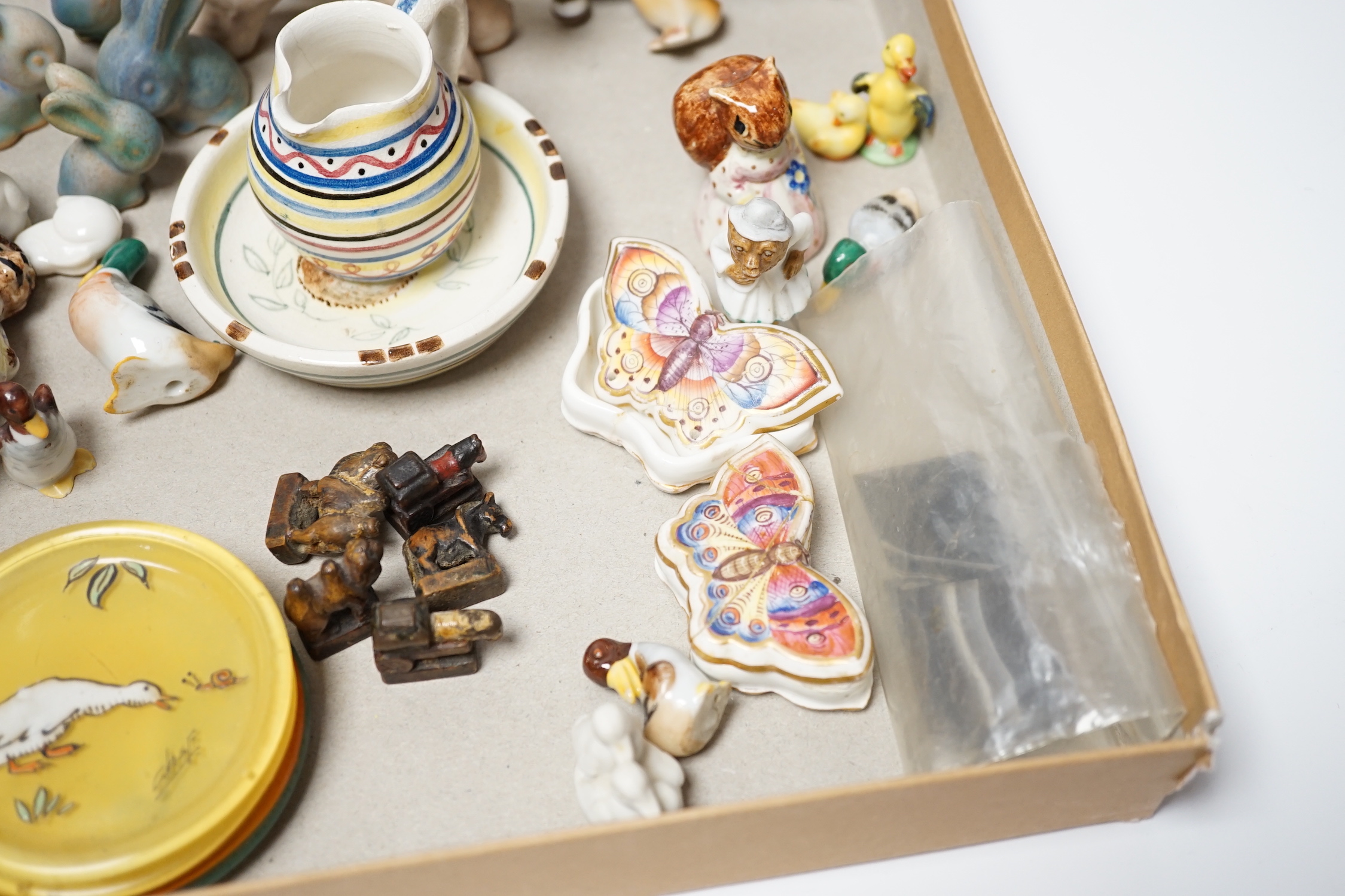 A collection of miniature china ornaments an agate box and black glass and enamel thermometer etc